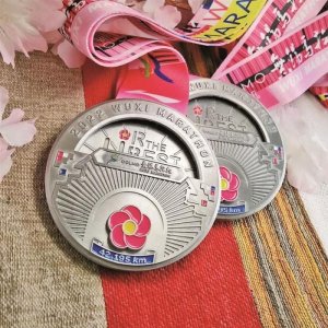 ​锡马奖牌“绽放” 暗藏“换脸”机关